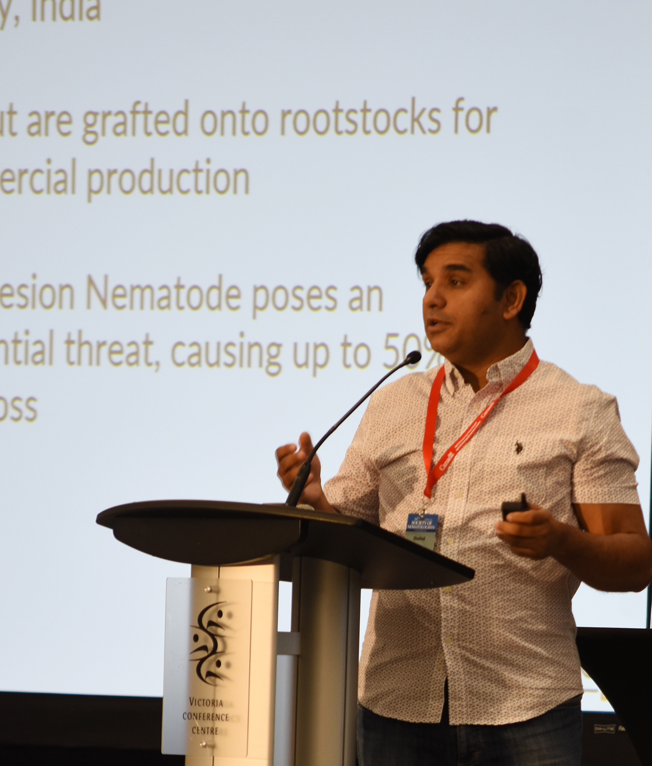 Shahid Siddique delivering a keynote address at the Society of Nematologists' meeting. (Photo courtesy of SON)