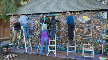 Workers begin installing the project.
