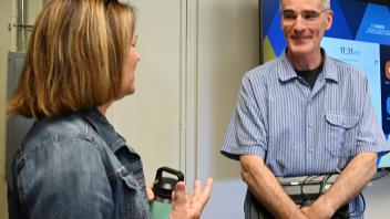 UC Davis professor and pollination ecologist Neal Williams talks with Vacaville Museum Guild vice president Tammy Gullett