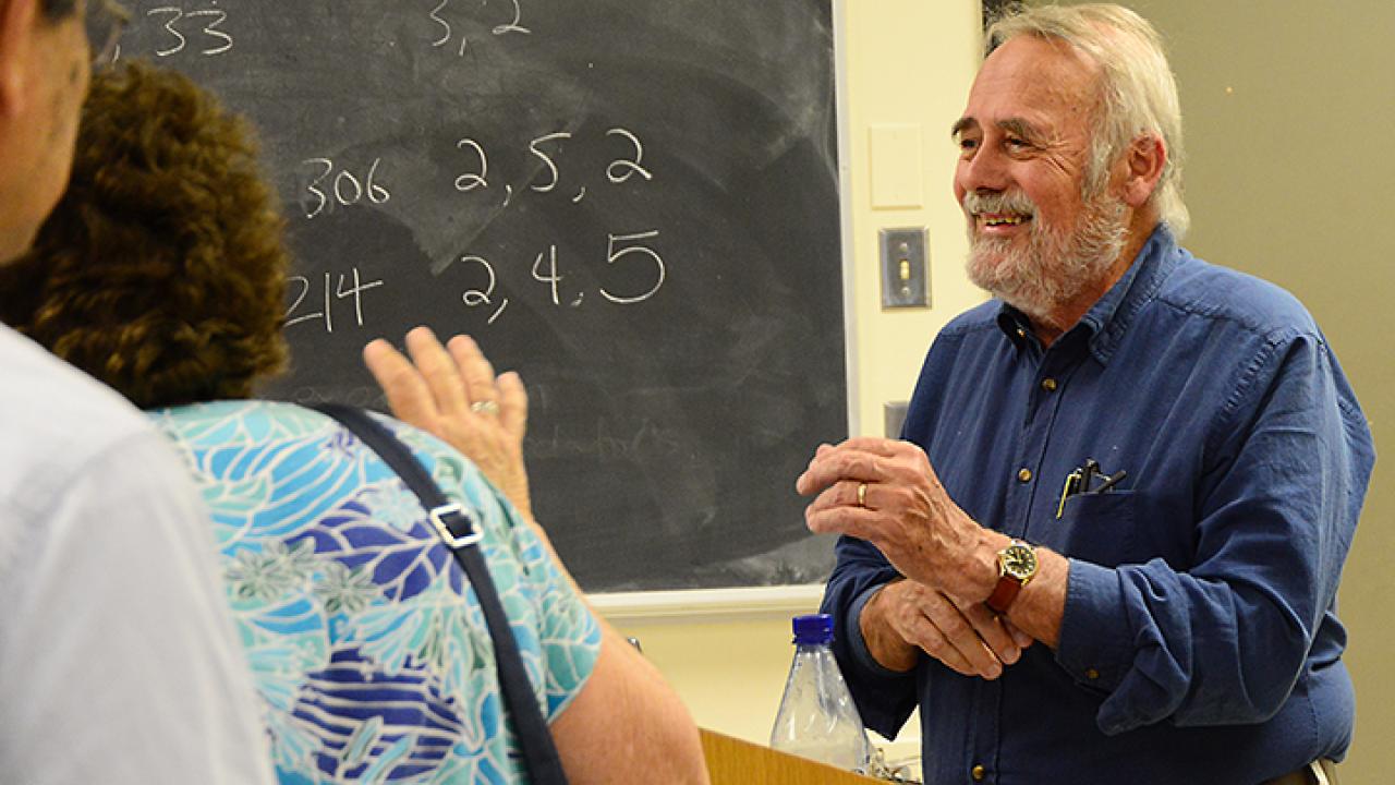 James R. Carey chatting with students