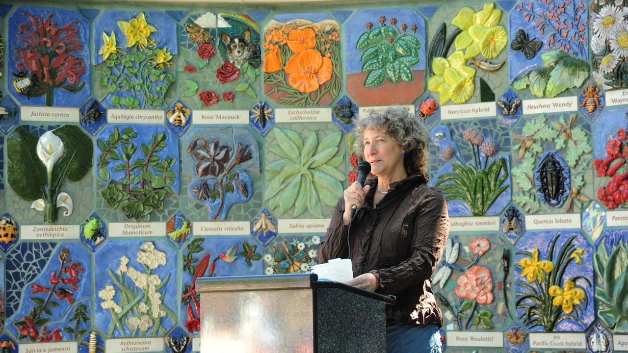 Entomologist-artist Diane Ullman, co-founder and co-director of the UC Davis Art/Science Fusion Program, speaks at the dedication of "Nature's Gallery" in the UC Davis Arboretum and Public Garden in 2012. (Photo by Kathy Keatley Garvey)