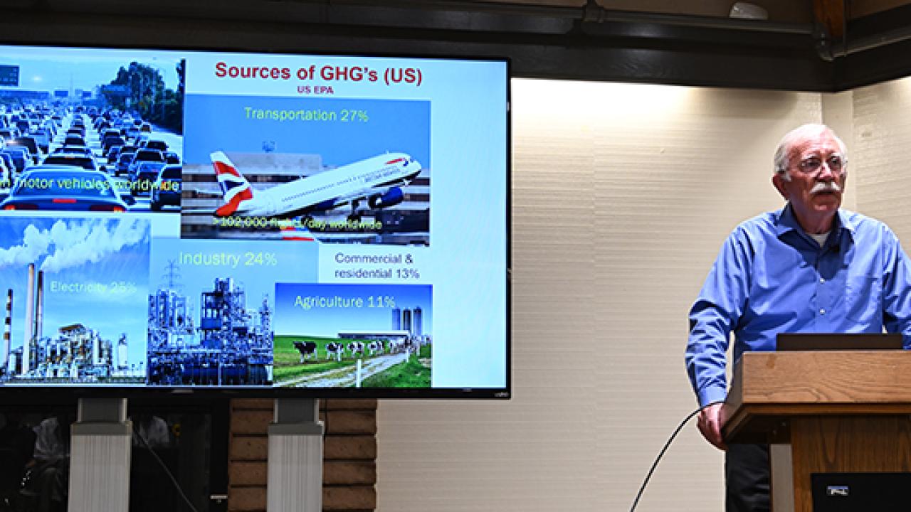 UC Davis doctoral alumnus and climate change activist Michael Hoffmann, emeritus professor, Cornell University, addresses crowd at his Thomas and Nina Leigh Alumni Award Seminar. (Photo by Kathy Keatley Garvey)
