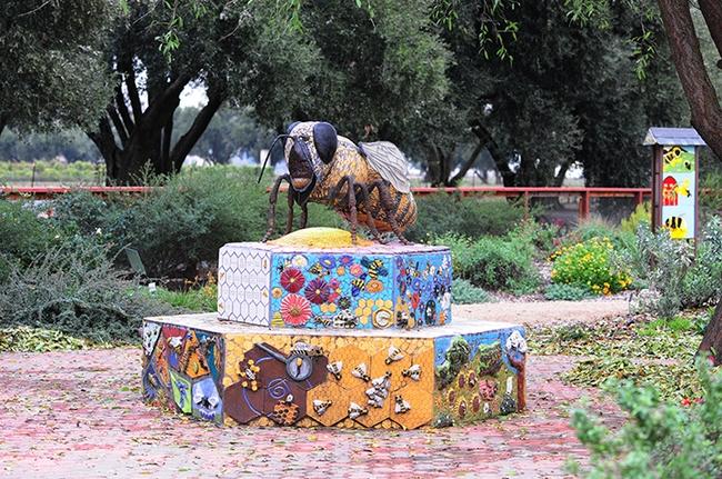 Miss Bee Haven, a mosaic-scupture of a worker bee, anchors the UC Davis Bee Haven. It is the work of Donna Billick of Davis, a co-founder of the UC Davis Art-Science Fusion Program. (Photo by Kathy Keatley Garvey)