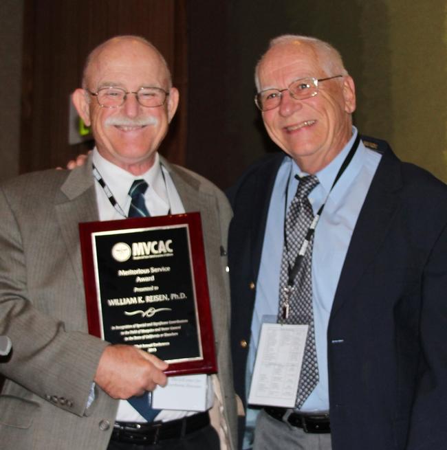 Medical entomologist Bruce Eldridge (right) presents the 2015 Meritorious Award for Service from MVCAC to medical entomologist William Reisen. Eldridge received the award in 1997. (Photo by Jill Oviatt, courtesy of MVCAC)