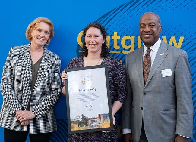 Tabatha Yang (center) with Chancellor Gary May and Clare Shinnerl