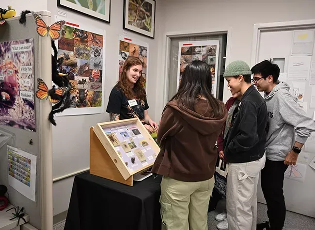 Emma "Em" Jochim of the Jason Bond lab interacting with open house guests. (Photo by Kathy Keatley Garvey)