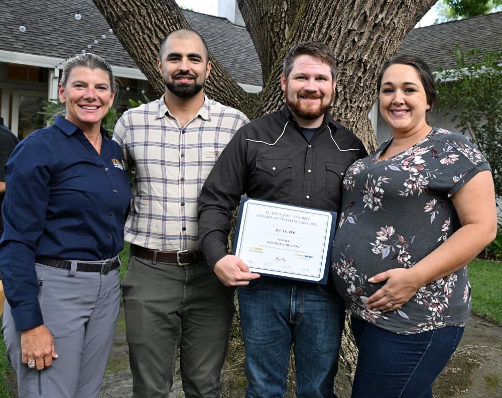 From left are Dean Ashley Stokes of the UC Davis College of Agricultural and Environmental Sciences, Kian Nikzad, co-program manager of the UC Davis-based California Master Beekeeper Program and a co-nominator; award recipient Joseph Tauzer and his wife, Kate. (Photo by Kathy Keatley Garvey)