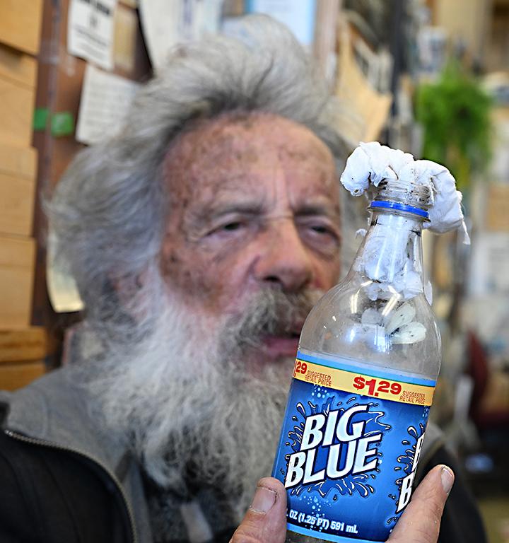 UC Davis distinguished professor emeritus Art Shapiro with the cabbage white butterfly inside the Big Blue soda bottle. (Photo by Kathy Keatley Garvey)(Photo by Kathy Keatley Garvey)