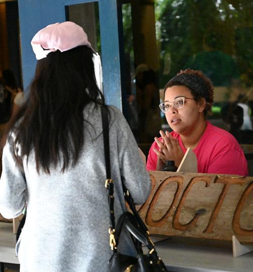 "Bug Doctor" Iris Quayle, a doctoral student in the Jason Bond lab, answers a question about insects at the UC Davis Picnic Day. (Photo by Kathy Keatley Garvey)