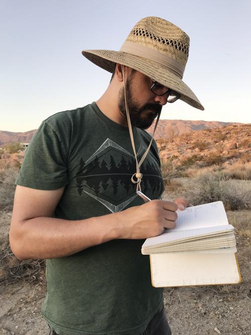 Chris Pagan recording notes on a collecting trip to the desert.