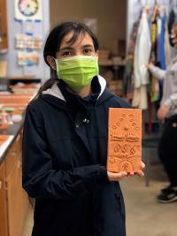 Ashley Valdez with bisque fired tile