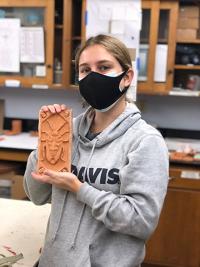 Lili Soucek with bisque fired tile