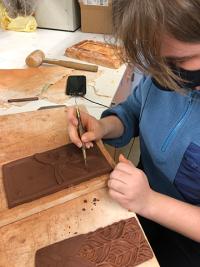 Lili Larsen Carving Her Tile