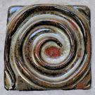 This tile is filled by a spiral design.