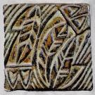 This design shows feathers superimposed on geometric designs.