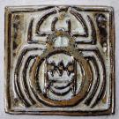 This tile shows an iconic indigenous spider design.