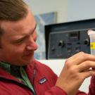 Marshall McMunn, assistant professor of teaching, examining a California gall wasp. (Photo by Jael Mackendorf)