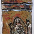 This tile shows the indigenous symbol for a horned toad, with a mountain and sun symbol above it.