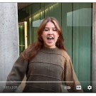 Video screenshot of Emma Vazquez rapping about food waste and sustainability