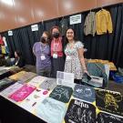 The UC Davis Graduate Student Association (EGSA) staffed a booth at the recent Entomological Society of America meeting in Phoenix. From left are members Ziv Lieberman, Iris Quayle and CC Edwards. (Photo courtesy of Lexie Martin, EGSA president)