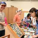 Rachel Vannette (foreground) and doctoral student (background) Gillian Bergmann greeting guests on UC Davis Picnic Day. The Vannette lab will be tabling at the Bohart Museum of Entomology open house on May 19. (Photo by Kathy Keatley Garvey)  