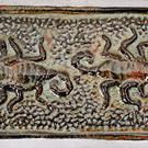 This tile shows two scorpions facing one another with their tails raised for striking.