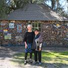 UC Davis distinguished professor Diane Ullman of the Department of Entomology and Nematology and  Gale Okumura, Department of Design faculty emerita,  in front of "A Bird's Eye View." 