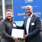 Joseph Tauzer, manager of the Harry H. Laidlaw Jr. Honey Bee Research Facility, receives congratulations from UC Davis Chancellor Gary May. (Photo by Kathy Keatley Garvey)