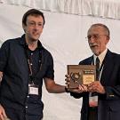 UC Davis Distinguished Emeritus Professor Howard Ferris (right) receives his Honorary Member award at the Society of Nematologists' meeting. With him is awards presenter Nathaniel Schroeder of Crops Science, University of Illinois, Urbana-Champaign. (SON Photo)